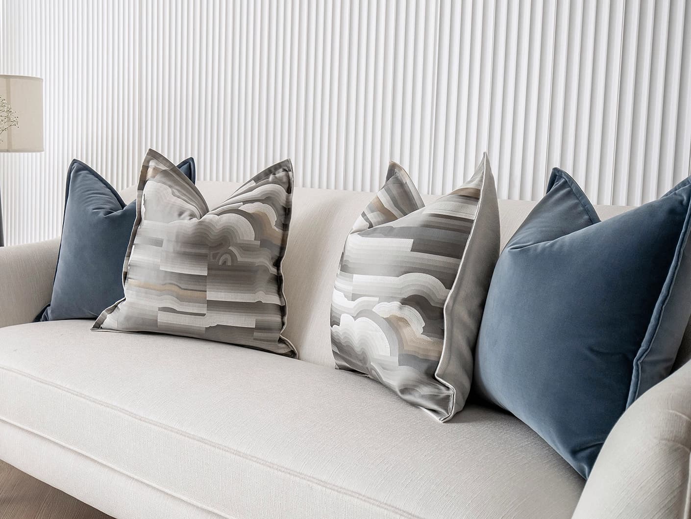 Guadalupe Bundle bundle cushions in blue and grey, shown in a lifestyle front view