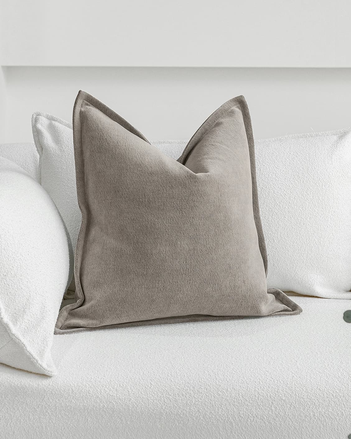 Haley Laurent cushion in grey and taupe, shown in a lifestyle front view as image 2