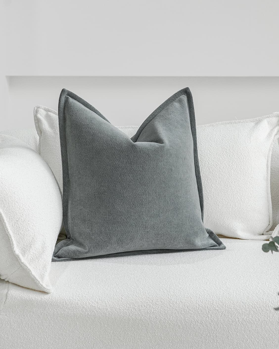 Haley Lucas cushion in azure and grey, shown in a lifestyle front view as image 2