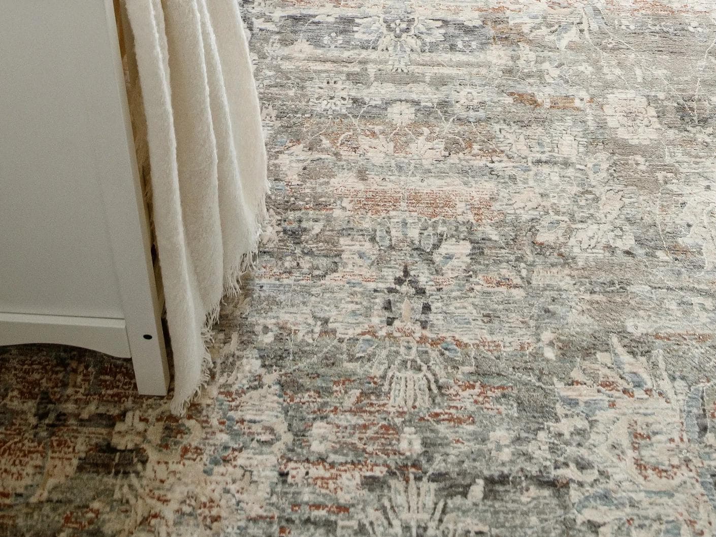 Hana Dune carpets in beige and rust, shown in a lifestyle close-up as image 2