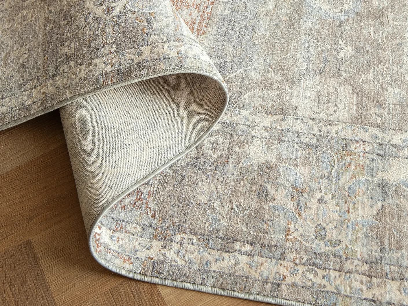 Hana Dune carpets in dune, beige and rust, shown in a product close-up view