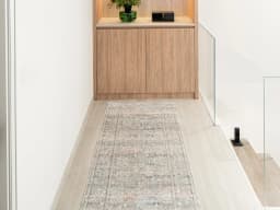 Hana Dune Runners carpet in beige and rust, shown in a lifestyle front view