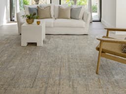 Hana Goldberg carpet in gold, shown in a lifestyle front view
