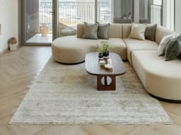 Hana Rust carpet in rust, shown in a lifestyle front view