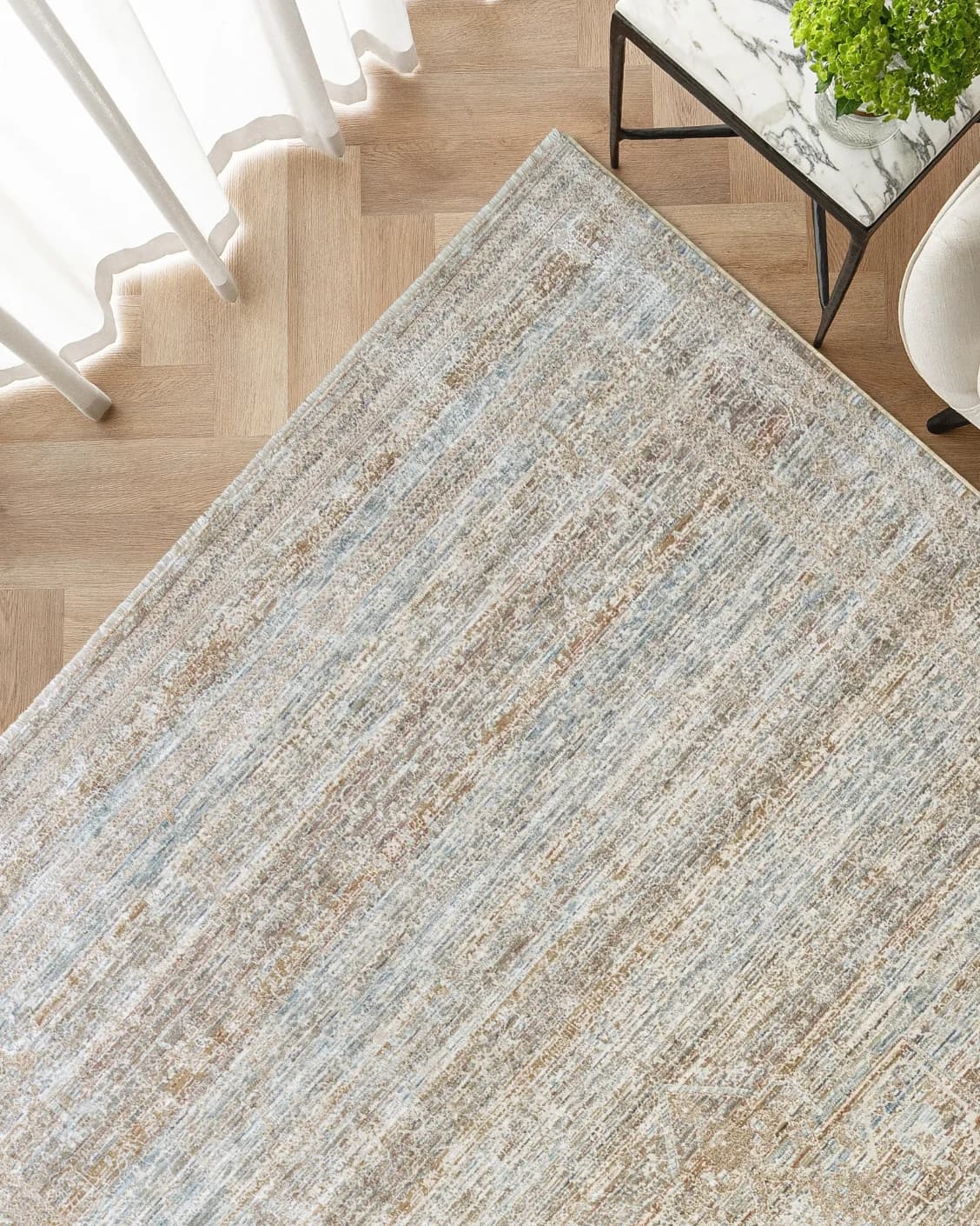 Hana Rust carpet, shown in a lifestyle top view as image 2