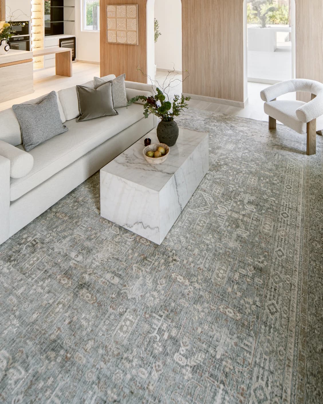 Hana Sky carpet in blue and grey, shown in a lifestyle left view as image 7