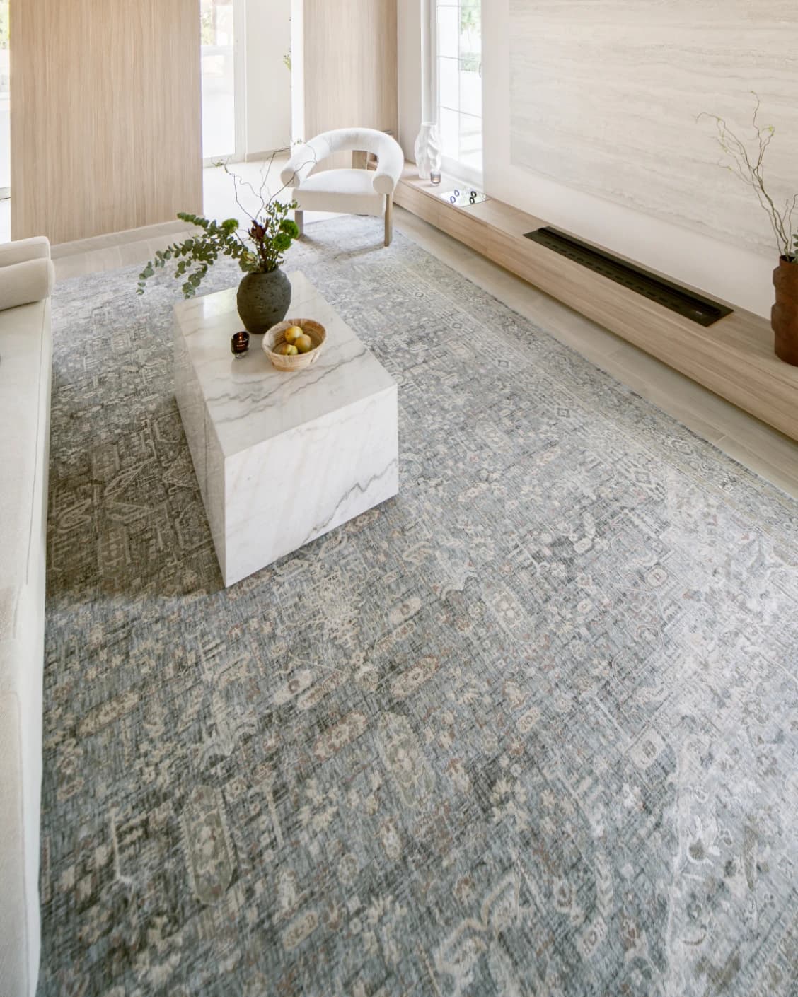 Hana Sky carpet in blue and grey, shown in a lifestyle left view as image 8