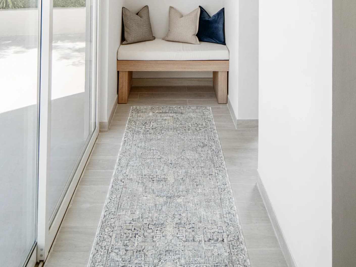 Hana Sky Runners carpet in blue and grey, shown in a lifestyle front view