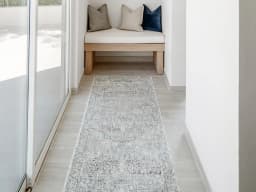 Hana Sky Runners carpet in blue and grey, shown in a lifestyle front view