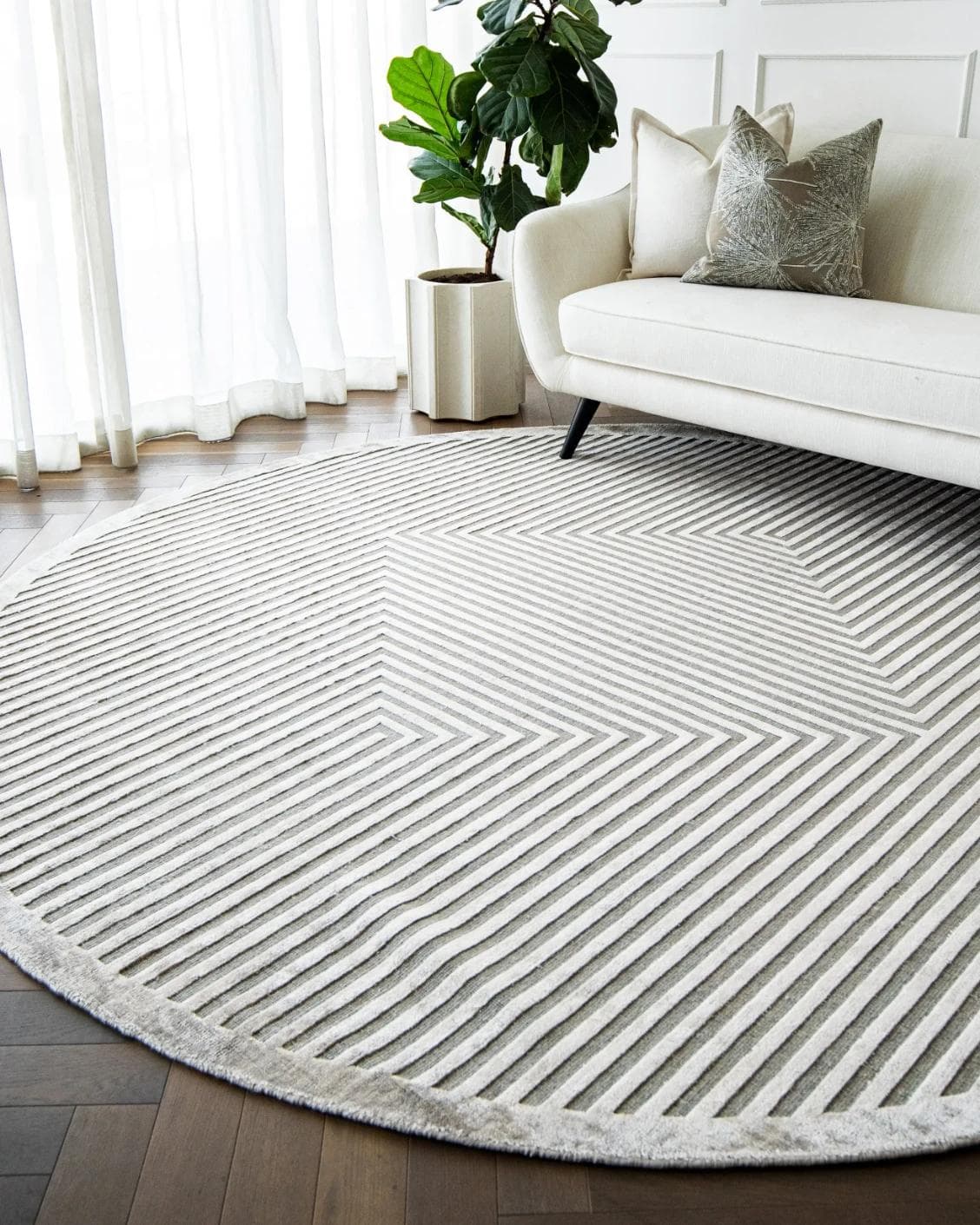 Harf Noon Ashton Round carpet in grey, shown in a lifestyle right view as image 4