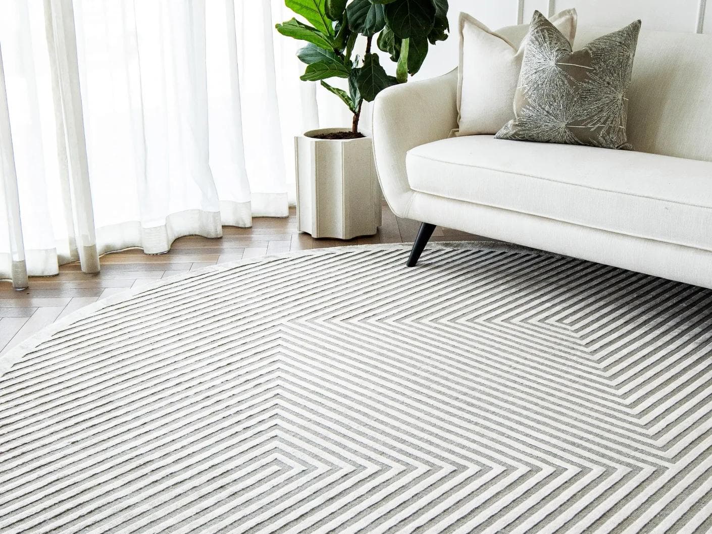 Harf Noon Ashton Round carpet in grey, shown in a lifestyle right view as image 4
