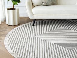 Harf Noon Ashton Round carpet in grey, shown in a lifestyle front view