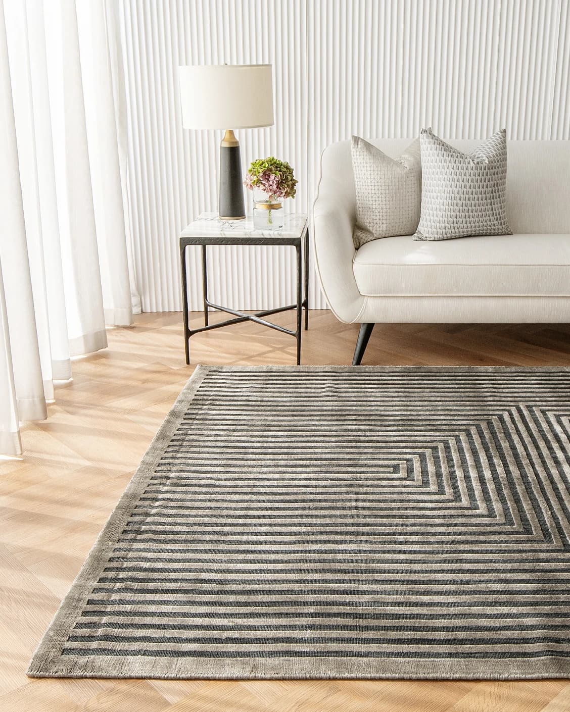 Harf Noon Ebony carpet in charcoal, shown in a lifestyle front view as image 4