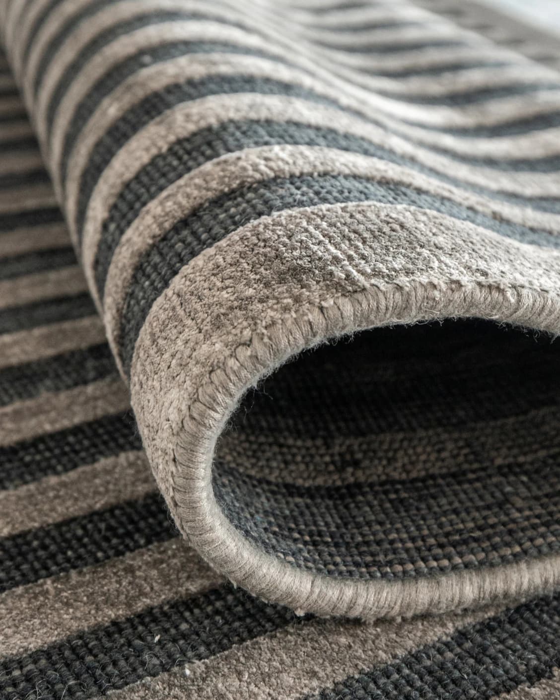 Harf Noon Ebony carpet in charcoal, shown in a product close-up as image 7