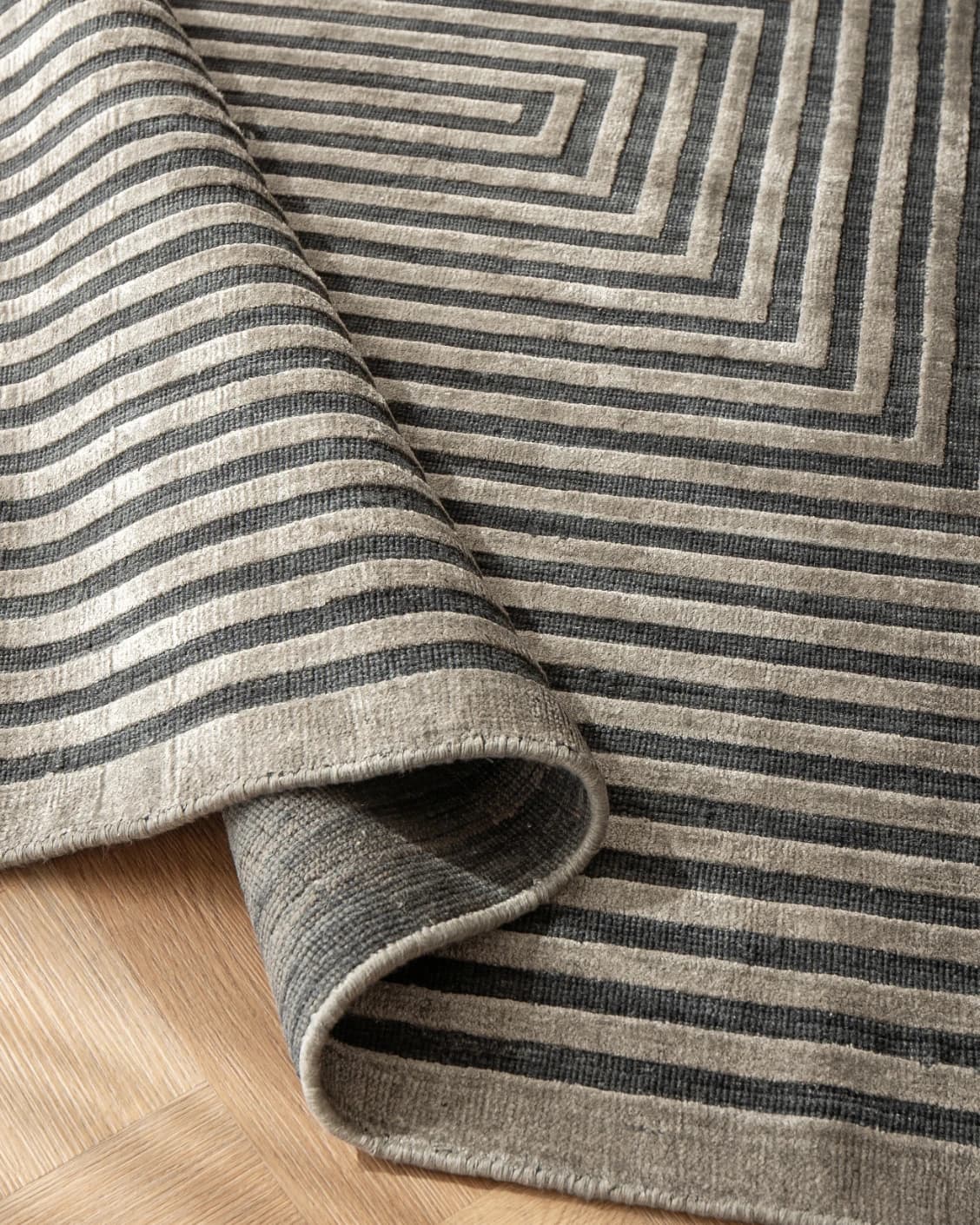Harf Noon Ebony carpet in charcoal, shown in a product close-up as image 8
