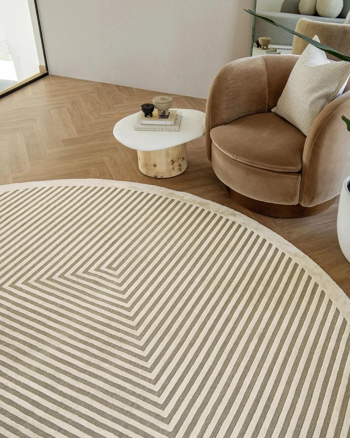 Harf Noon Sandy Round carpet in beige and ivory, shown in a lifestyle top view as image 4