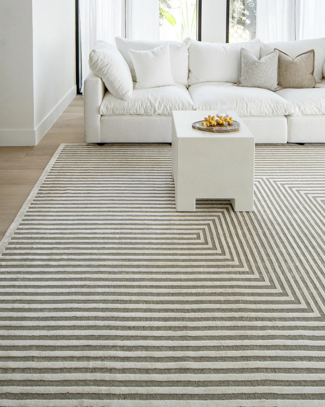 Harf Noon Sandy carpet in beige and ivory, shown in a lifestyle front view as image 5