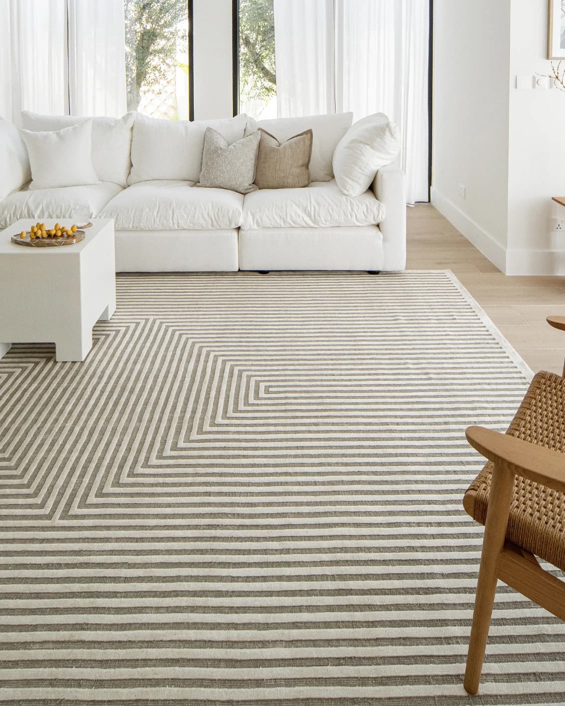 Harf Noon Sandy carpet in beige and ivory, shown in a lifestyle front view as image 6