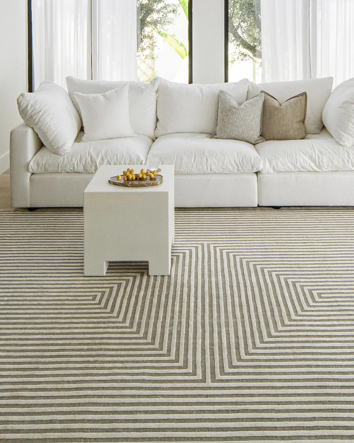 Harf Noon Sandy carpet in beige and ivory, shown in a lifestyle front view as image 7