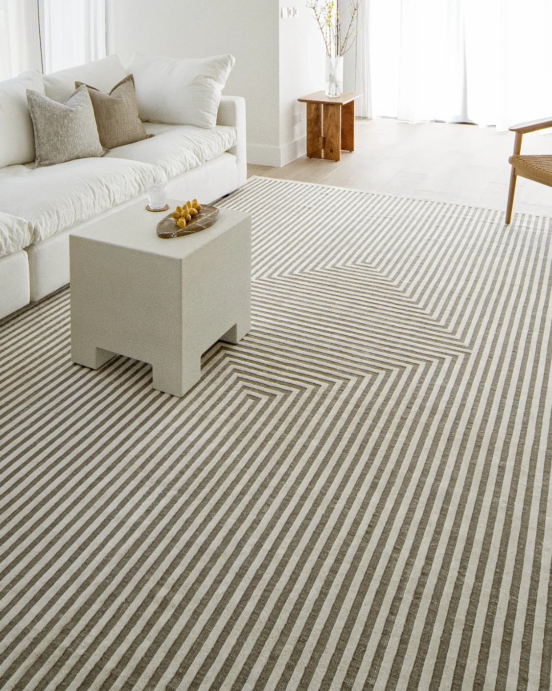 Harf Noon Sandy carpet in beige and ivory, shown in a lifestyle left view as image 8