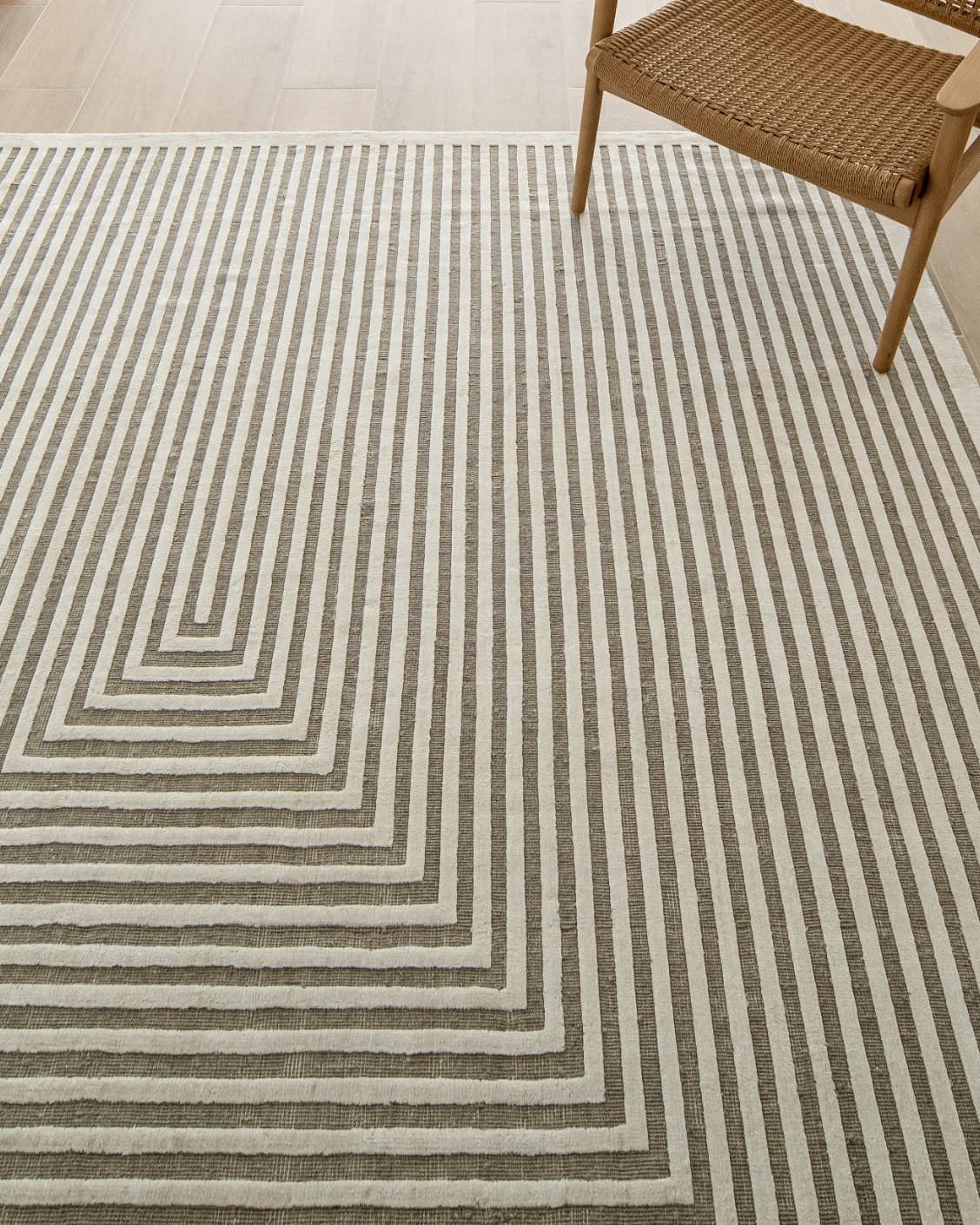 Harf Noon Sandy carpet in beige and ivory, shown in a lifestyle top view as image 10