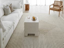 Harf Noon Sandy carpet in sandy, beige and ivory, shown in a lifestyle front view
