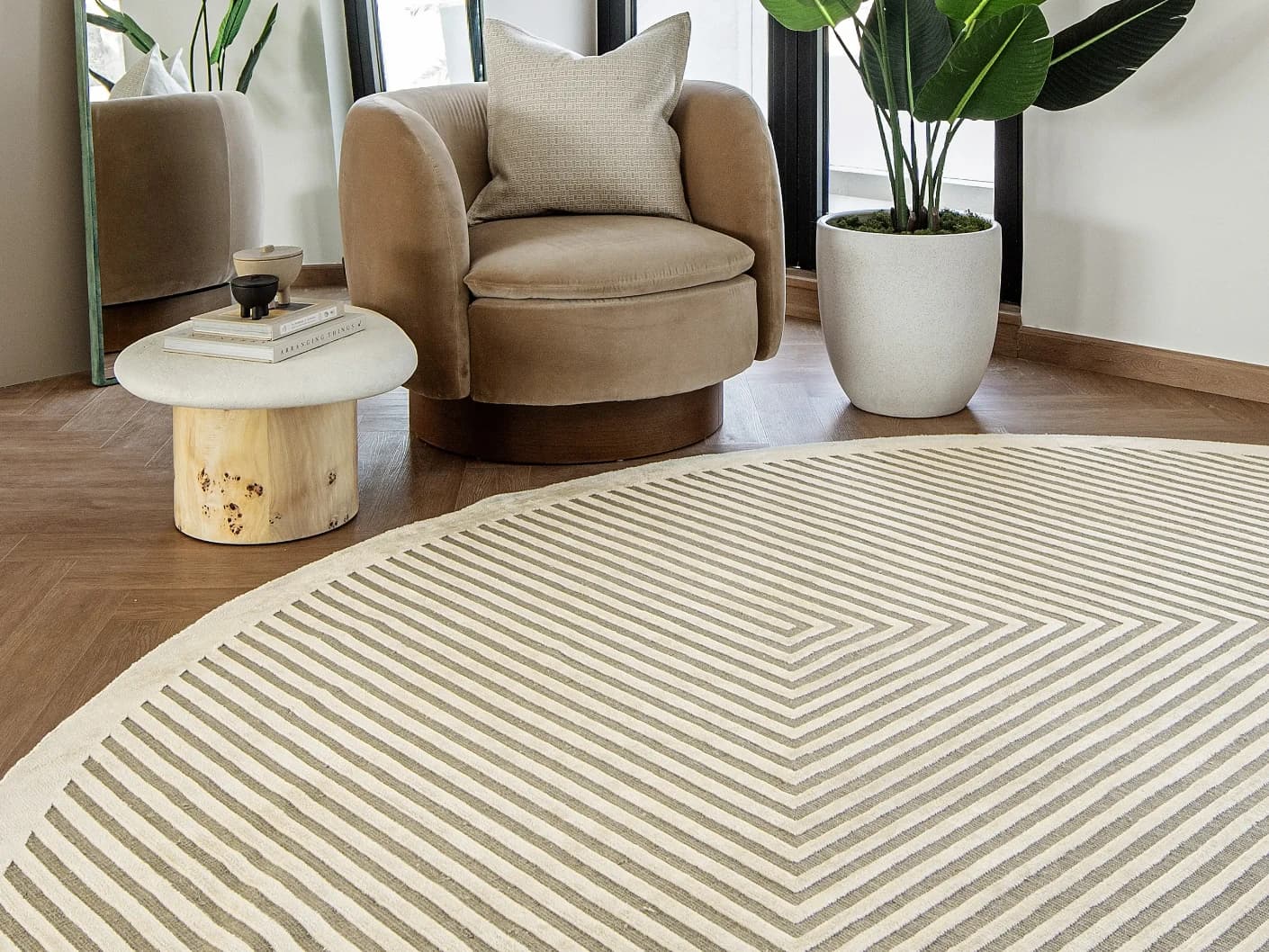 Harf Noon Sandy Round carpet in beige and ivory, shown in a lifestyle front view