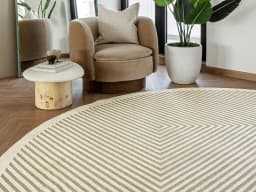 Harf Noon Sandy Round carpet in beige and ivory, shown in a lifestyle front view