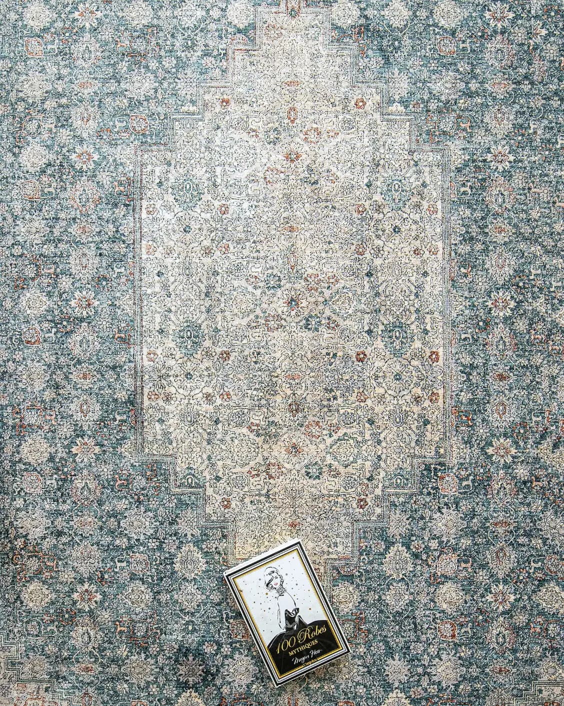 Harper Sky carpet in blue, shown in a lifestyle top view as image 6