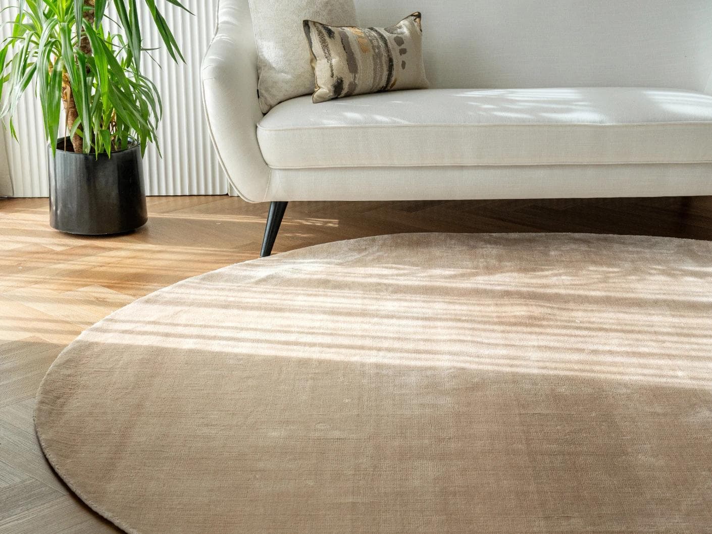 Hartman Sandy Round carpet in beige, shown in a lifestyle front view as image 2