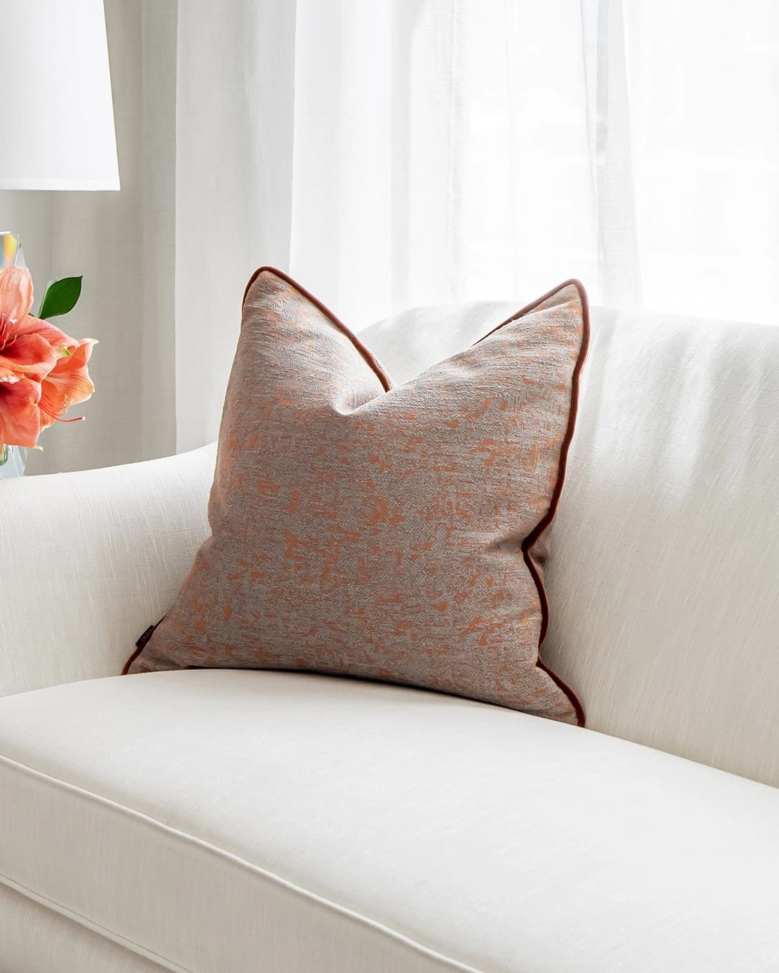 Hazel Tangelo cushion in orange and red, shown in a lifestyle front view as image 2
