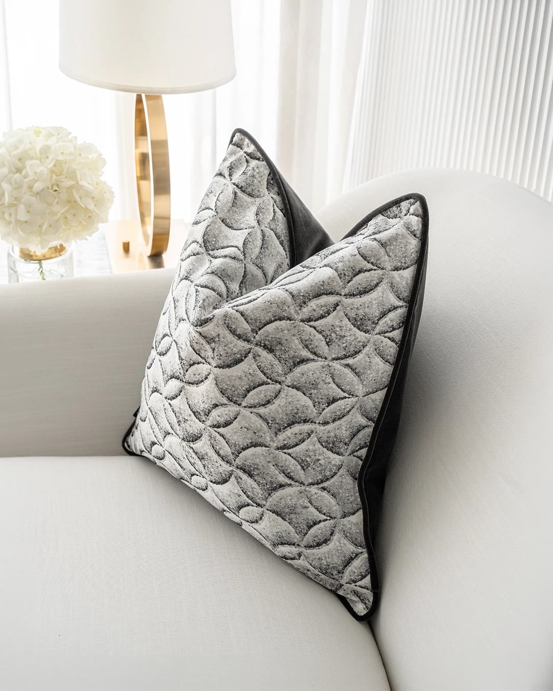 Heera Steele cushion in white and black, shown in a lifestyle right view as image 2