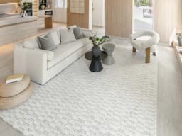 Henry Alba carpet in ivory and grey, shown in a lifestyle front view
