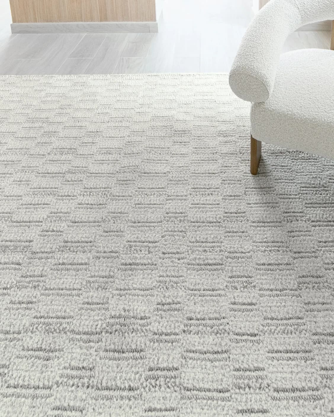 Henry Alba carpet in ivory and grey, shown in a lifestyle close-up as image 4