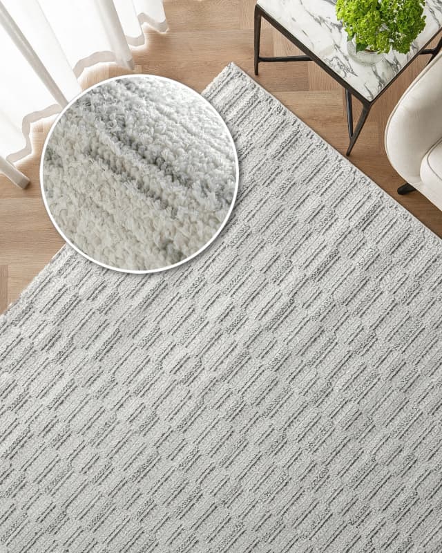 Henry Alba carpet in ivory and grey, shown in a lifestyle top view as image 2
