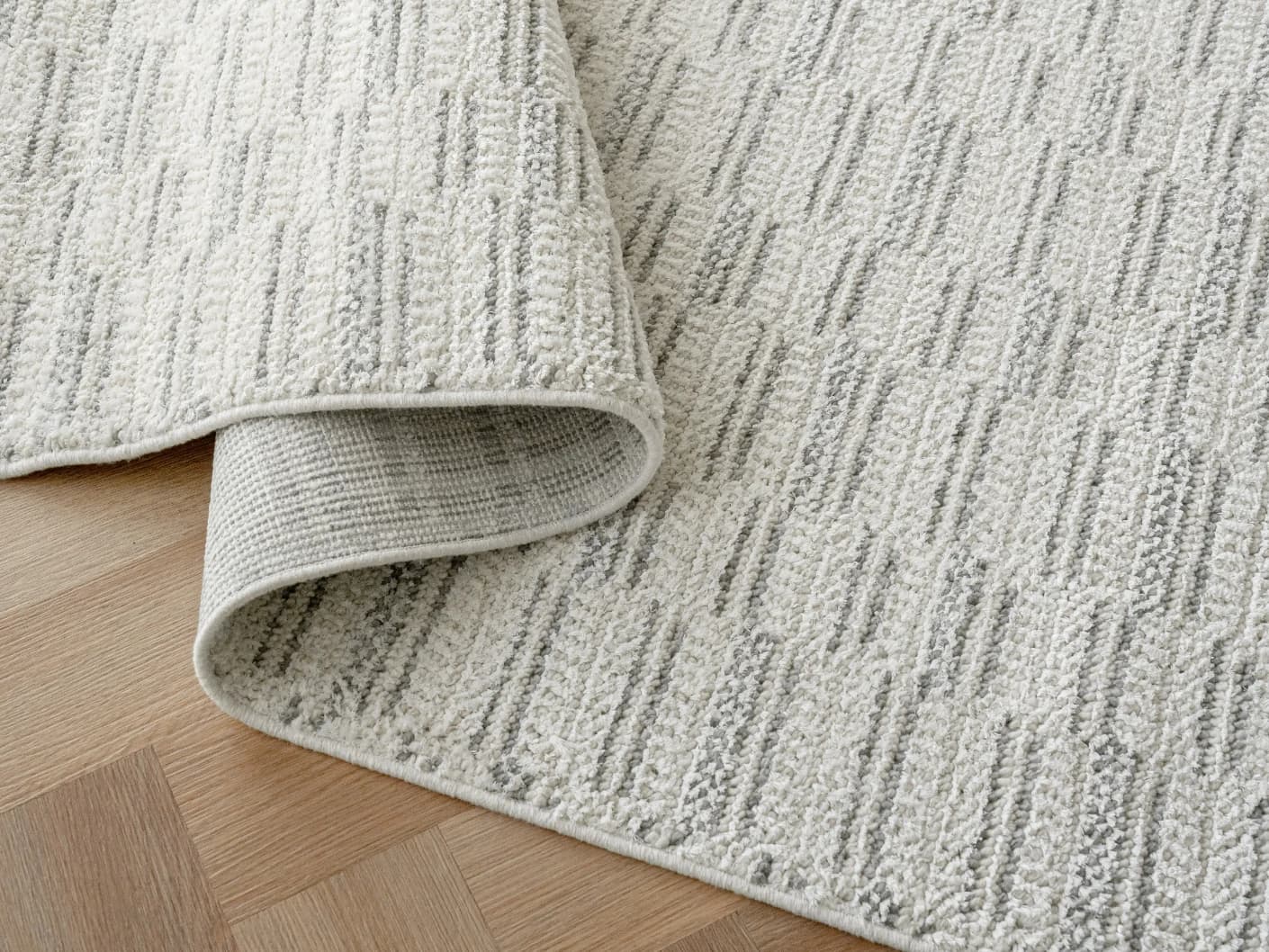 Henry Alba carpets in ivory and grey, shown in a product close-up view