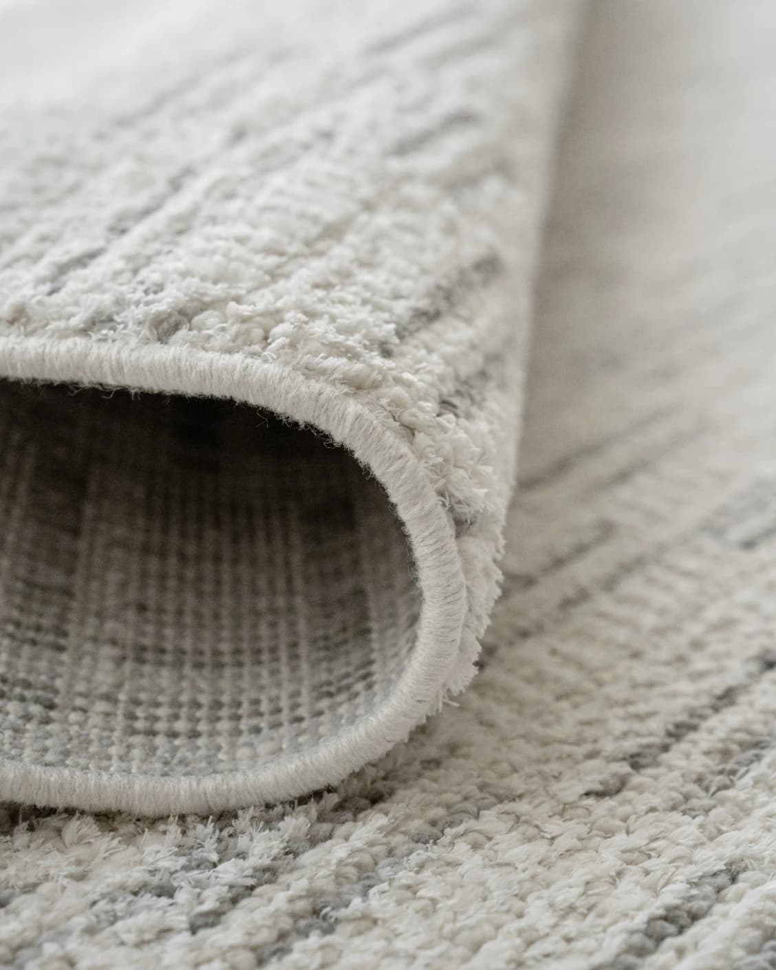Henry Alba carpet in ivory and grey, shown in a product close-up as image 11