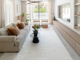 Henry Bianca carpet in ivory and pearl, shown in a lifestyle front view