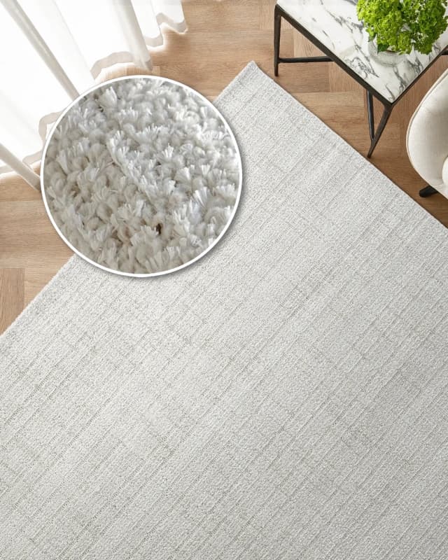 Henry Bianca carpet in ivory and pearl, shown in a lifestyle top view as image 2