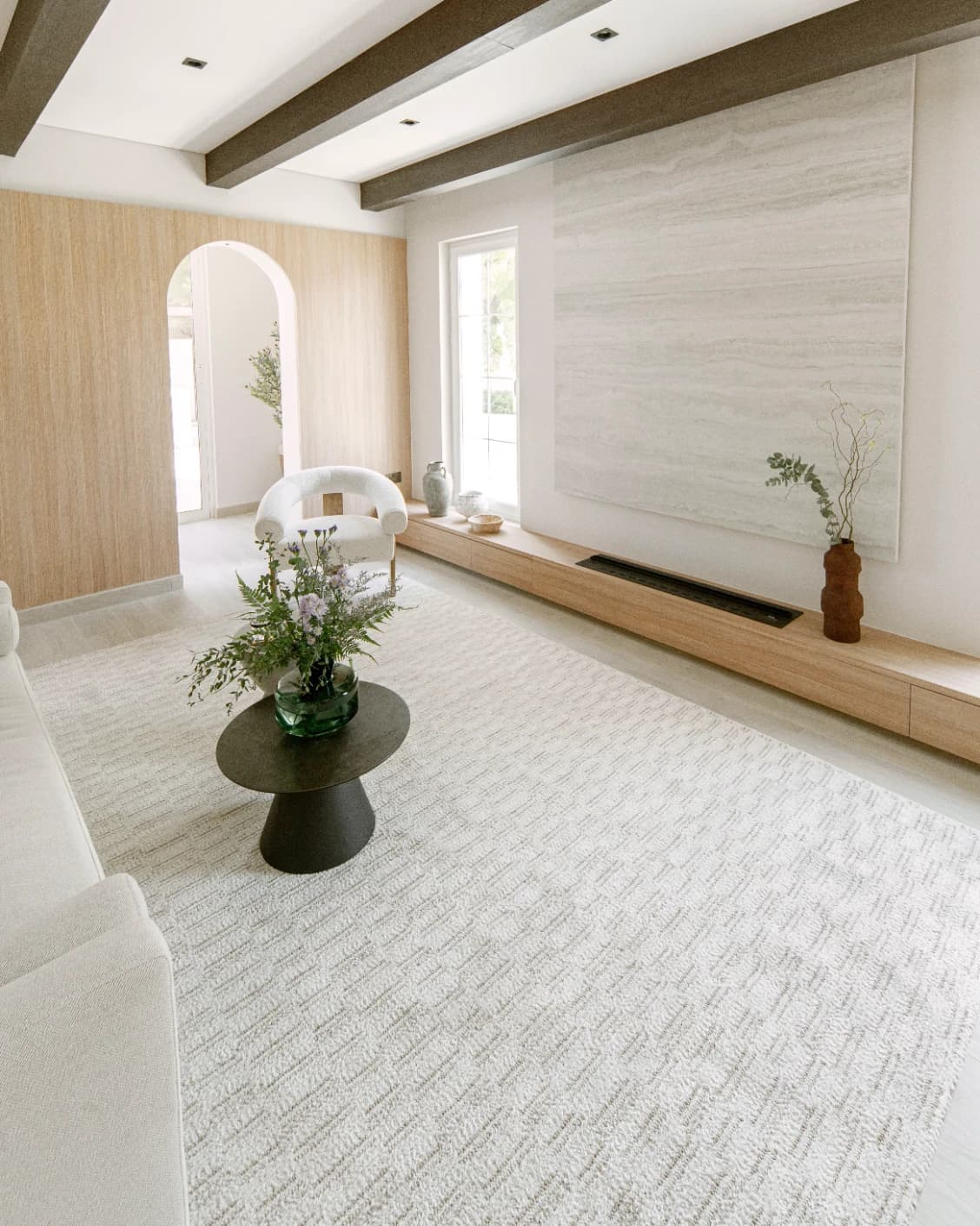 Henry Dune carpet in beige, shown in a lifestyle left view as image 7