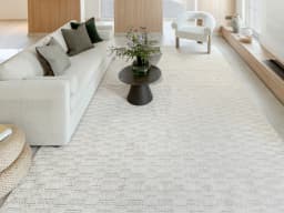 Henry Dune carpet in dune and beige, shown in a lifestyle front view