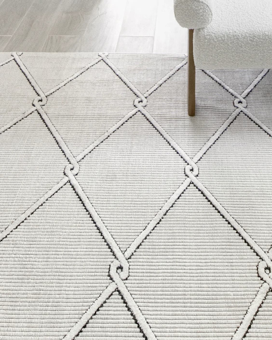 Henry Dusty carpet in ivory and charcoal, shown in a lifestyle close-up as image 4