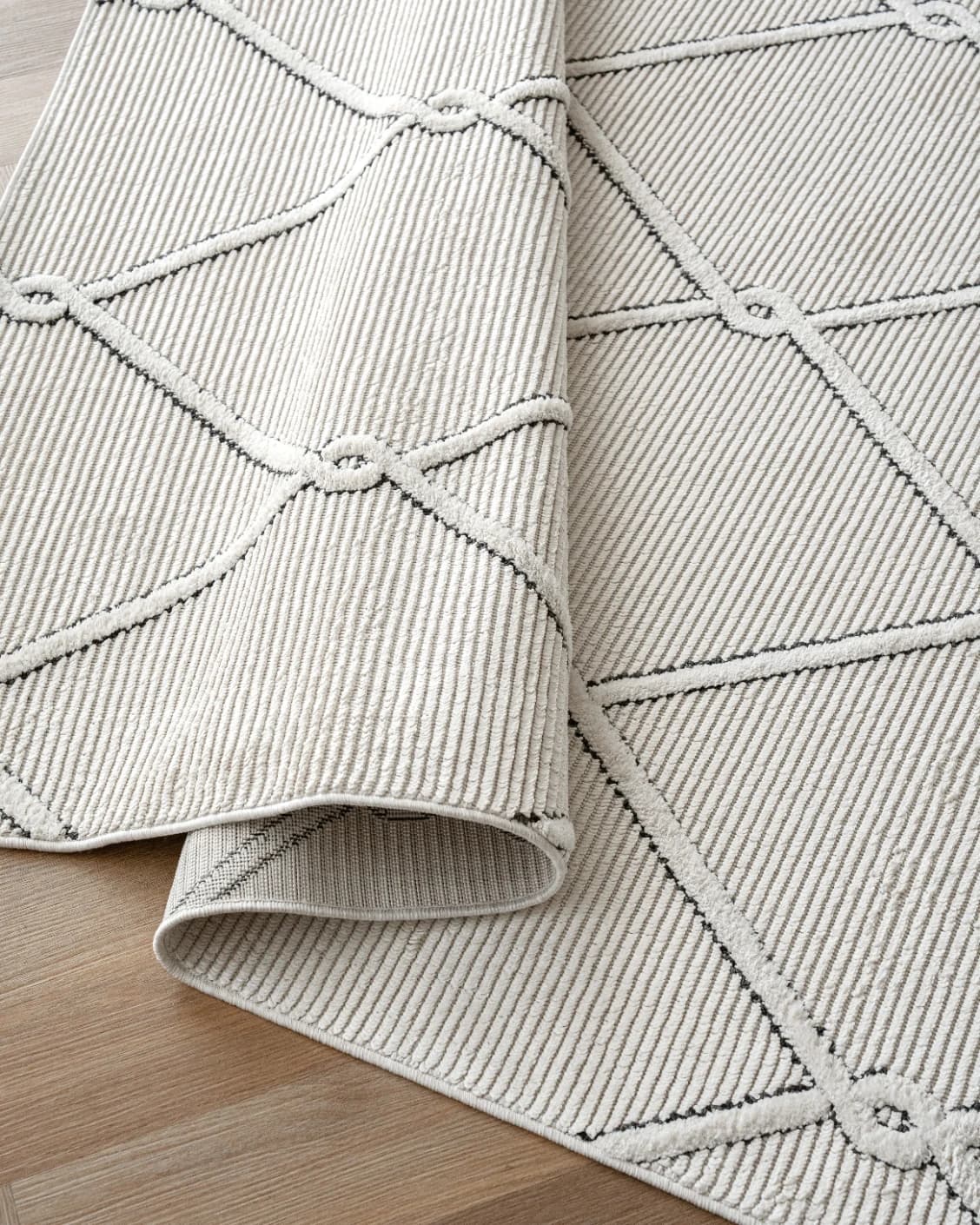 Henry Dusty carpet in ivory and charcoal, shown in a product close-up as image 11