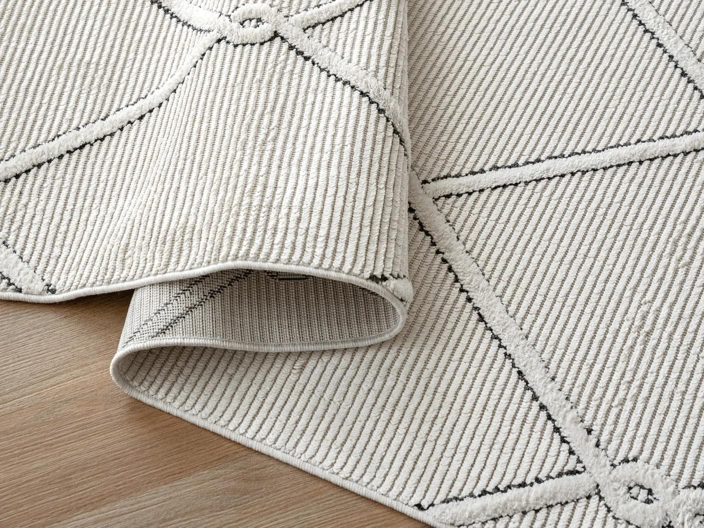 Henry Dusty carpet in ivory and charcoal, shown in a product close-up as image 11