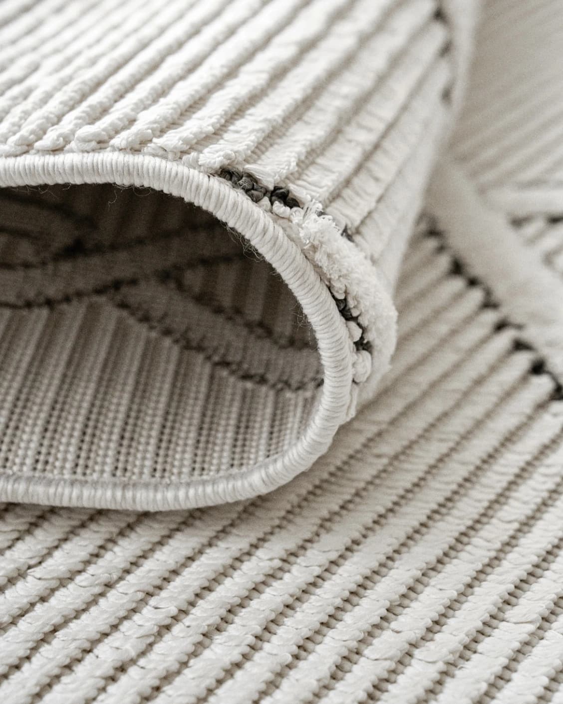 Henry Dusty carpet in ivory and charcoal, shown in a product close-up as image 12