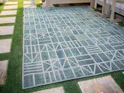 Hunter Sky carpet in sky and turquoise, shown in a lifestyle front view