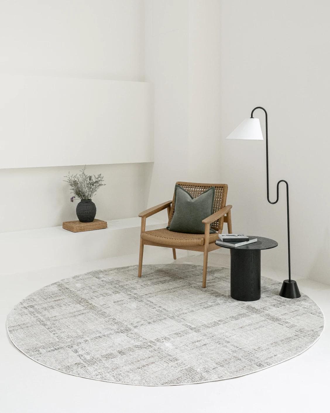 Ada Ivory Round carpet in taupe, shown in a lifestyle front view