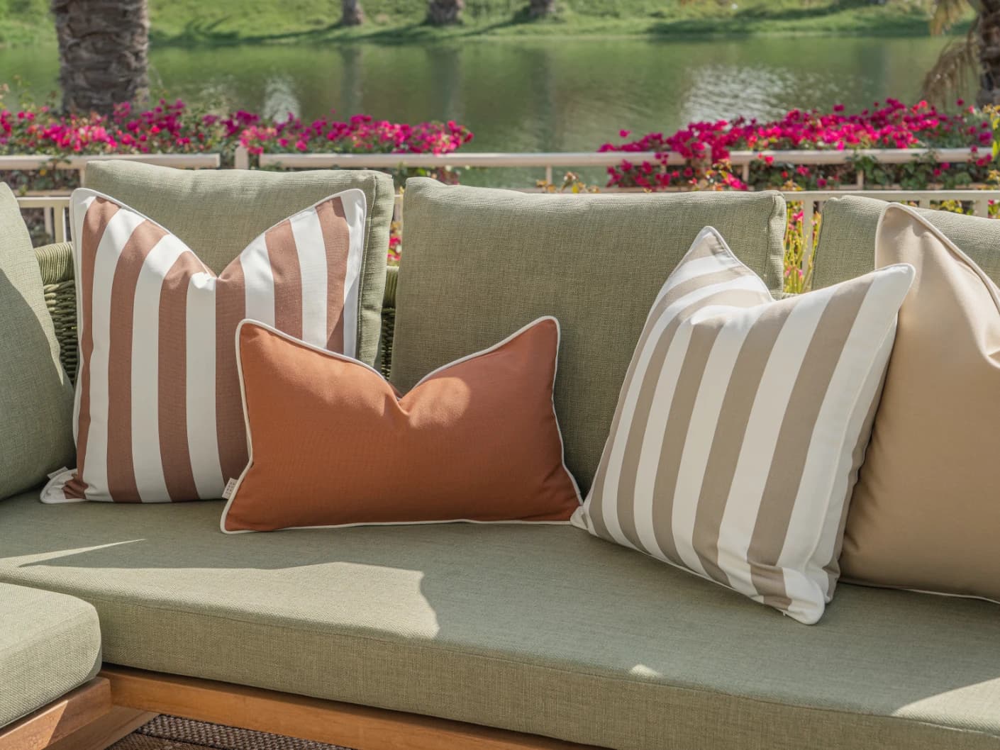 Imani Bundle bundle cushions in brown and rust, shown in a lifestyle front view