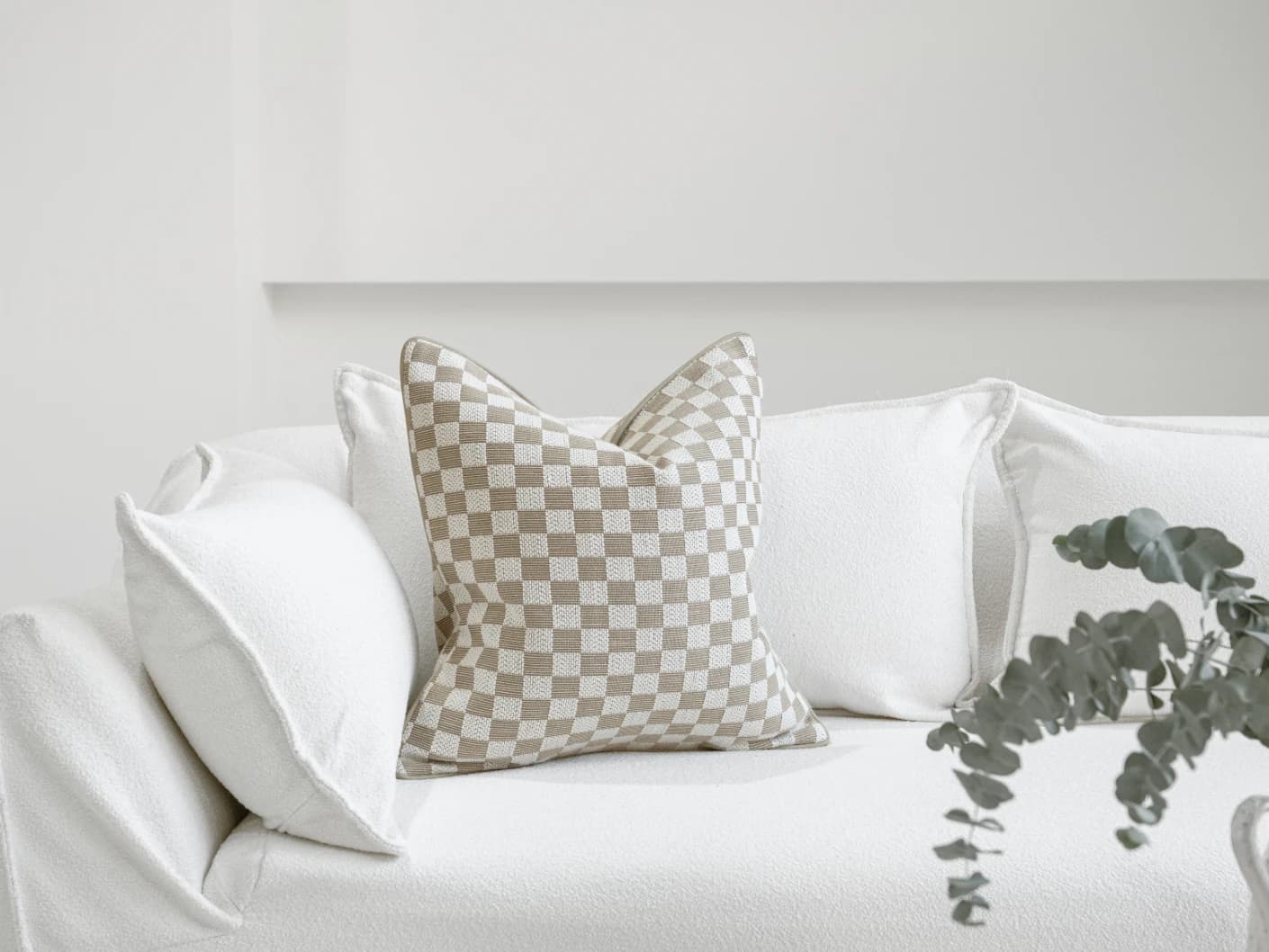 Ina Klimt single cushions in beige, shown in a lifestyle front view