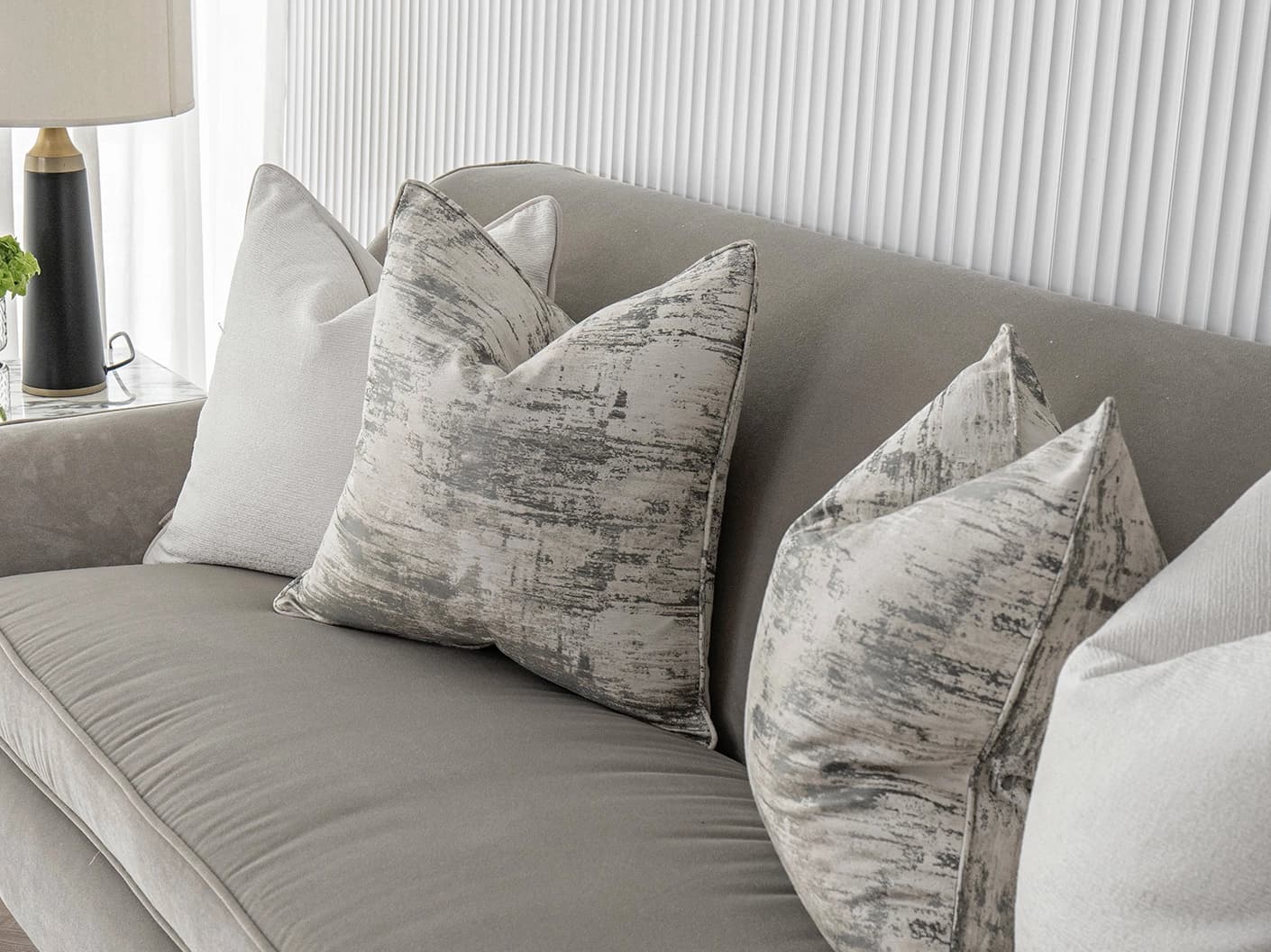 Indira Bundle bundle cushions in white, shown in a lifestyle front view